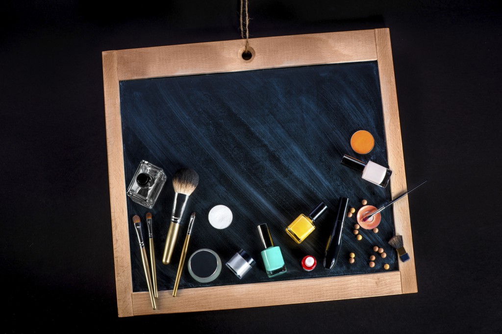 various cosmetic and makeup on chalkboard or blackboard with spa